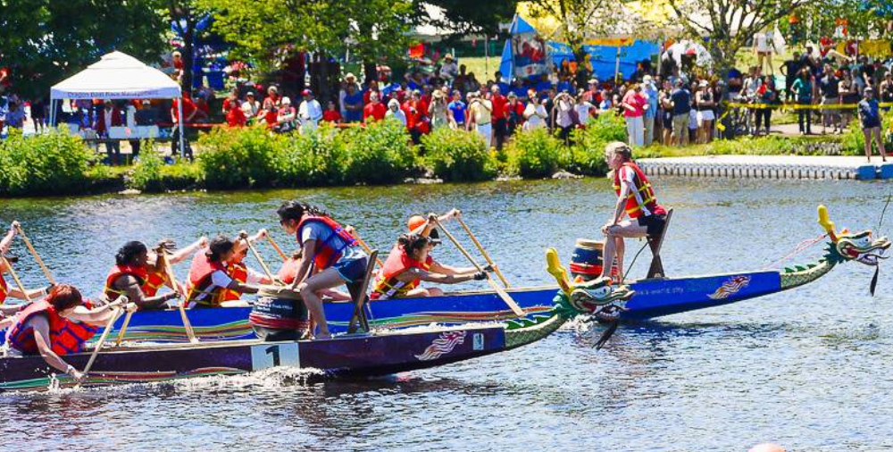 Dragon boat teams racing on Charles River during Boston festival